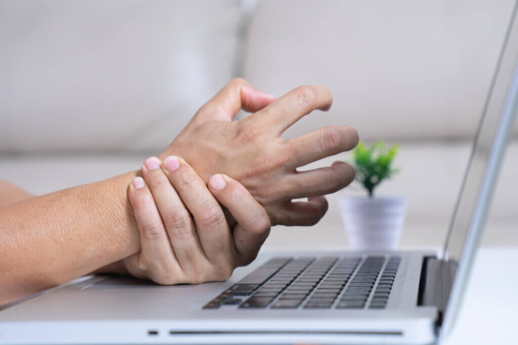 young man hand pain, wrist pain